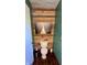 Powder room featuring a toilet with a wooden accent wall and decor at 6602 S 400 W, Columbus, IN 47201