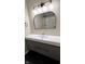 Bathroom featuring modern vanity with a white counter top, mirror, and modern lighting at 6602 S 400 W, Columbus, IN 47201