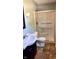 Bathroom with a vanity sink, toilet, and enclosed shower with glass doors at 6602 S 400 W, Columbus, IN 47201