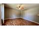 Bedroom with laminate wood flooring, neutral colored walls, and a ceiling fan at 6602 S 400 W, Columbus, IN 47201