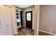 Inviting foyer with wood floors, closet, and an entrance door with decorative glass at 6602 S 400 W, Columbus, IN 47201