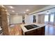 Open kitchen view with an island cooktop, modern appliances, and seamless access to living areas at 6602 S 400 W, Columbus, IN 47201