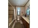 The bathroom features a bathtub, a tile backsplash, and a vanity with neutral color at 6895 N County Road 625 E, Brownsburg, IN 46112