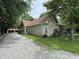 Charming home features a gravel driveway and well-maintained grounds at 6895 N County Road 625 E, Brownsburg, IN 46112