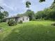 Quaint single-story home with a spacious lawn and mature trees at 6895 N County Road 625 E, Brownsburg, IN 46112