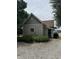 Side angle of exterior features a well maintained yard and gravel driveway at 6895 N County Road 625 E, Brownsburg, IN 46112