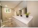 Bright bathroom featuring a white vanity, updated mirror, and neutral color palette at 71 E Cove Ct, Cicero, IN 46034