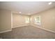 Cozy bedroom featuring neutral walls, new carpet, and two large windows providing ample natural light at 71 E Cove Ct, Cicero, IN 46034