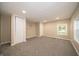 Spacious bedroom with plush gray carpeting, double closets, and natural light from multiple windows at 71 E Cove Ct, Cicero, IN 46034