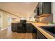 Updated kitchen showcases a black range, butcher block countertops, and modern fixtures and finishes at 71 E Cove Ct, Cicero, IN 46034