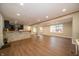 Spacious open-concept space with wood-look floors and stylish half-wall divider at 71 E Cove Ct, Cicero, IN 46034
