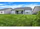 Spacious backyard with a covered patio, ideal for outdoor living and entertaining at 7195 Rose Hill Ave, Brownsburg, IN 46112