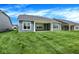 Lush backyard featuring a covered patio with ample space for outdoor enjoyment at 7195 Rose Hill Ave, Brownsburg, IN 46112