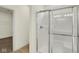 Bathroom with glass shower, neutral paint and tile, and walk-in closet at 7195 Rose Hill Ave, Brownsburg, IN 46112