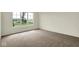 Bedroom with carpet flooring and a large window overlooking the exterior at 7195 Rose Hill Ave, Brownsburg, IN 46112