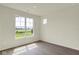 Bedroom featuring a window with views of the outdoors and neutral color scheme at 7195 Rose Hill Ave, Brownsburg, IN 46112