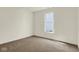 An inviting bedroom featuring plush carpet and a well-lit space from a large window at 7195 Rose Hill Ave, Brownsburg, IN 46112