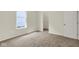 Cozy bedroom with plush carpet, closet, and natural light from the window at 7195 Rose Hill Ave, Brownsburg, IN 46112