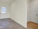 Bright entryway featuring wood-style flooring and crisp white trim at 7195 Rose Hill Ave, Brownsburg, IN 46112