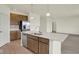 Well-equipped modern kitchen with an island, stainless steel appliances and wooden cabinetry at 7195 Rose Hill Ave, Brownsburg, IN 46112
