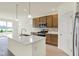 Kitchen featuring stainless appliances, a large island, and an adjacent breakfast area with a scenic view at 7195 Rose Hill Ave, Brownsburg, IN 46112