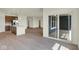 Open-concept living space flowing into a modern kitchen with an island and stainless steel appliances at 7195 Rose Hill Ave, Brownsburg, IN 46112