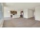 An open-concept view of the living room and kitchen areas featuring modern stainless appliances at 7195 Rose Hill Ave, Brownsburg, IN 46112