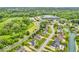 Aerial view showcasing residential community, golf course, and commercial amenities nearby at 720 Willow Pointe North Dr, Plainfield, IN 46168