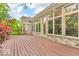 A large wooden deck featuring a wall of windows showcasing the house's interior at 720 Willow Pointe North Dr, Plainfield, IN 46168