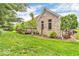 A charming brick home featuring a cozy deck and lush green lawn at 720 Willow Pointe North Dr, Plainfield, IN 46168