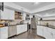 Finished basement featuring stainless steel appliances, a wine cooler, and stylish cabinets at the wet bar at 720 Willow Pointe North Dr, Plainfield, IN 46168