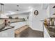 Basement wet bar area featuring white cabinets, a granite countertop, and stylish pendant lighting at 720 Willow Pointe North Dr, Plainfield, IN 46168