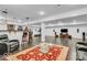 Open basement with a bar area, exercise equipment, and entertainment setup with TV and speakers at 720 Willow Pointe North Dr, Plainfield, IN 46168