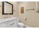 Bathroom features a marble countertop, modern faucet, and a stylish mirror above the white vanity at 720 Willow Pointe North Dr, Plainfield, IN 46168