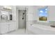 Stylish bathroom with walk-in shower, soaking tub, marble vanity, and great natural light at 720 Willow Pointe North Dr, Plainfield, IN 46168