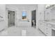 Modern bathroom features marble floors, separate shower, soaking tub, and double vanity at 720 Willow Pointe North Dr, Plainfield, IN 46168