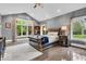 A beautifully designed main bedroom with high ceilings, large windows and a sitting area at 720 Willow Pointe North Dr, Plainfield, IN 46168