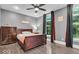 This bedroom features hardwood floors, a fan and light fixture, and large windows at 720 Willow Pointe North Dr, Plainfield, IN 46168
