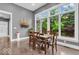 Cozy dining area with large windows providing natural light and views of the greenery at 720 Willow Pointe North Dr, Plainfield, IN 46168
