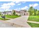 Charming brick home with a well-manicured lawn and three-car garage at 720 Willow Pointe North Dr, Plainfield, IN 46168