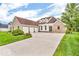 Stunning brick home boasts a spacious three-car garage and a meticulously maintained lawn, enhancing its curb appeal at 720 Willow Pointe North Dr, Plainfield, IN 46168