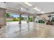 Open garage with finished floor, lawn care equipment, and open door at 720 Willow Pointe North Dr, Plainfield, IN 46168