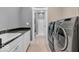 This laundry room has side by side machines and a laundry sink at 720 Willow Pointe North Dr, Plainfield, IN 46168
