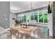 Open living room featuring hardwood floors, large windows, and comfortable seating, creating an inviting atmosphere at 720 Willow Pointe North Dr, Plainfield, IN 46168