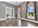 Elegant living room featuring high ceilings, hardwood floors, and large windows with scenic views at 720 Willow Pointe North Dr, Plainfield, IN 46168