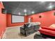 Basement theater room with tiered seating, a large screen, and surround sound speakers for entertainment at 720 Willow Pointe North Dr, Plainfield, IN 46168
