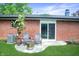 Cozy backyard patio featuring outdoor seating, a fire pit and manicured garden at 7234 Fairwood Dr, Indianapolis, IN 46256