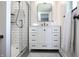 Modern bathroom vanity with clean lines, white color, and marble countertop paired with a glass door shower at 7234 Fairwood Dr, Indianapolis, IN 46256