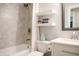 Bright, updated bathroom with a tiled shower, floating shelves, sleek fixtures, and a modern vanity at 7234 Fairwood Dr, Indianapolis, IN 46256