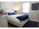 Inviting bedroom featuring a comfortable bed with soft blue accents and stylish decor at 7234 Fairwood Dr, Indianapolis, IN 46256